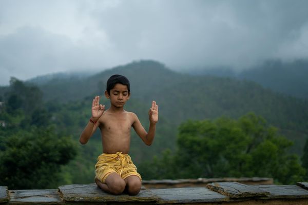 Person practicing yoga in a calm, focused environment.